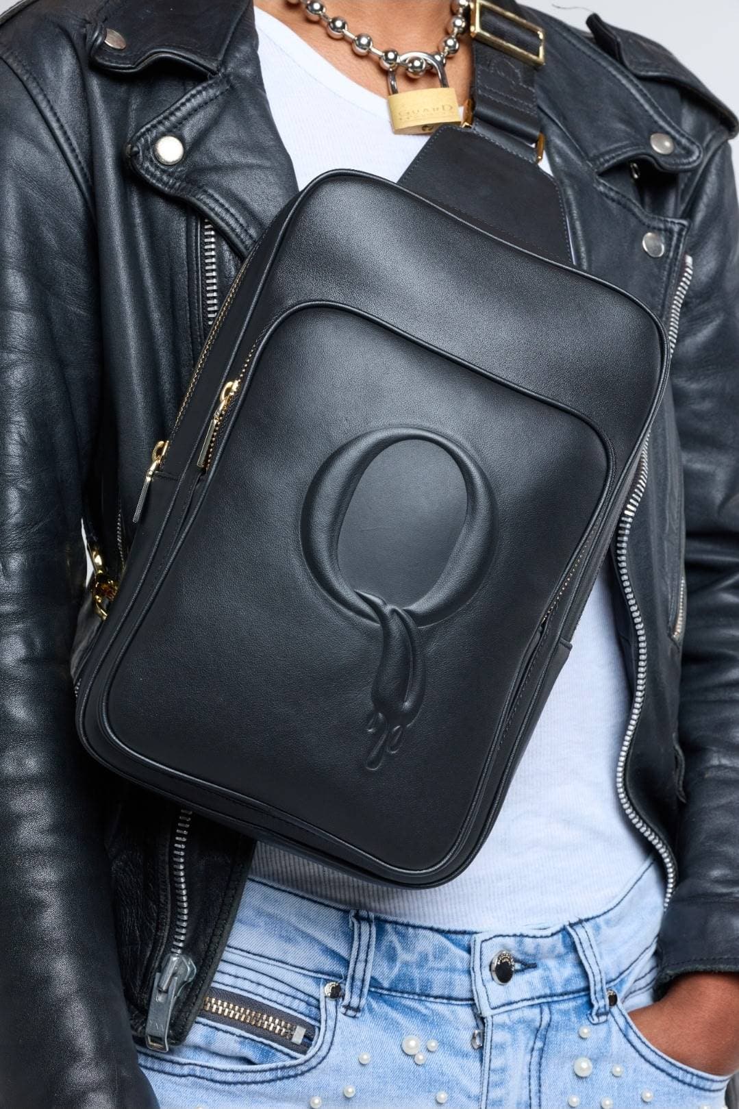 QUEER Official Statement Sling with leather jacket